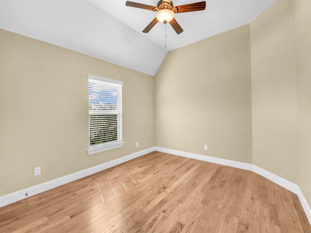 169 Pack Saddle Trail Weatherford, TX 76088 - Photo 20 of 40 a view of an empty room with wooden floor and a window