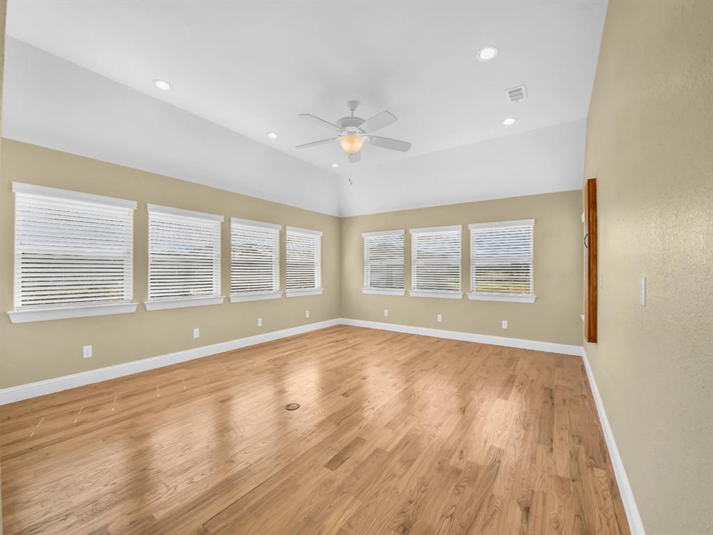 169 Pack Saddle Trail Weatherford, TX 76088 - Photo 25 of 40 a view of an empty room with wooden floor and a window