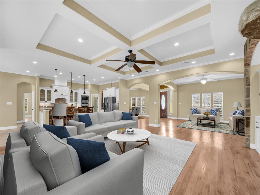 169 Pack Saddle Trail Weatherford, TX 76088 - Photo 3 of 40 a living room with furniture kitchen view and a wooden floor