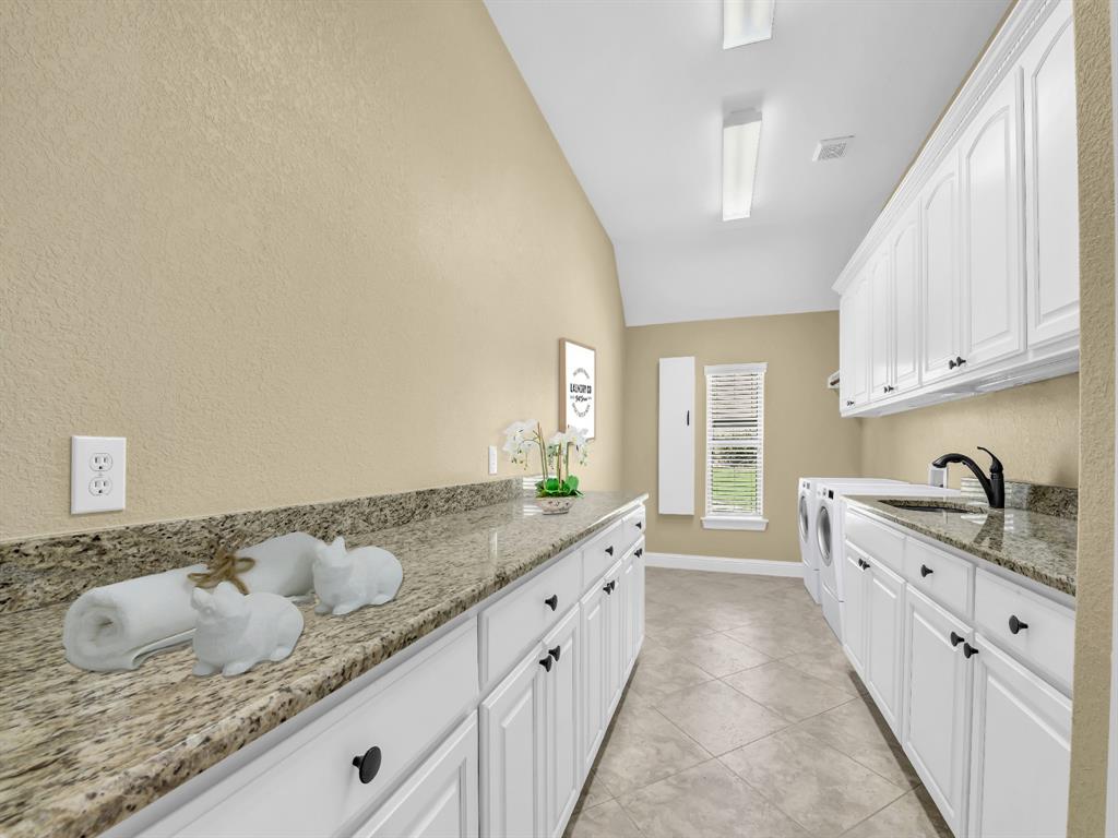 169 Pack Saddle Trail Weatherford, TX 76088 - Photo 30 of 40 a bathroom with a granite countertop double vanity sink and mirror
