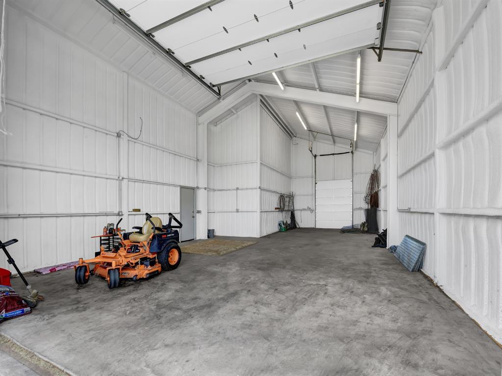 169 Pack Saddle Trail Weatherford, TX 76088 - Photo 37 of 40 a view of a garage with parked cars