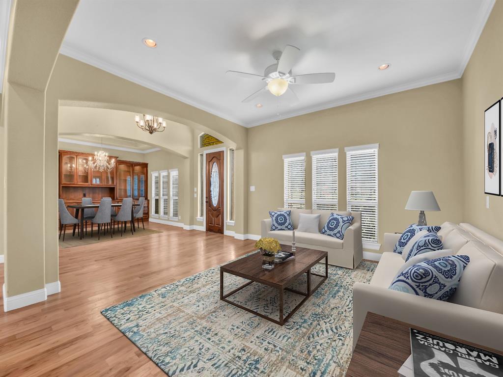 169 Pack Saddle Trail Weatherford, TX 76088 - Photo 7 of 40 a living room with furniture and wooden floor