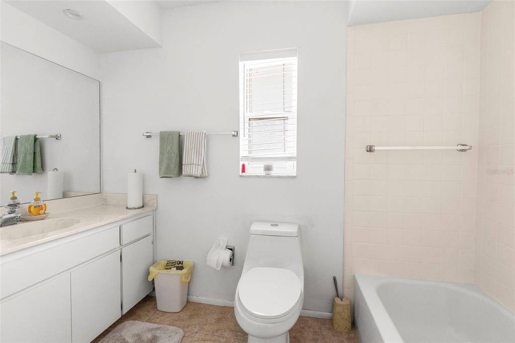 2509 Westchester Boulevard Spring Hill, FL 34606 - Photo 12 of 29 a bathroom with a sink a toilet and vanity