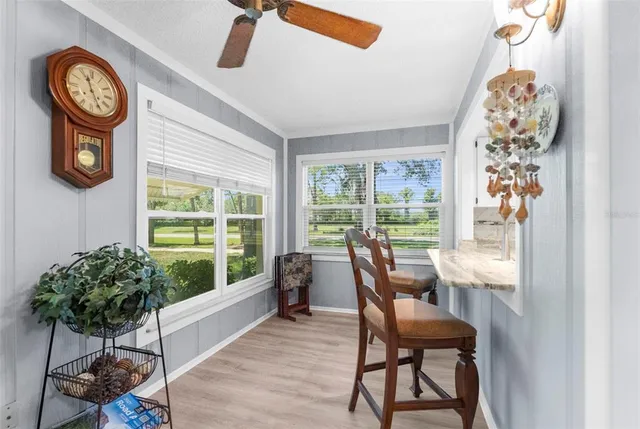 a kitchen with a sink a stove and a microwave oven