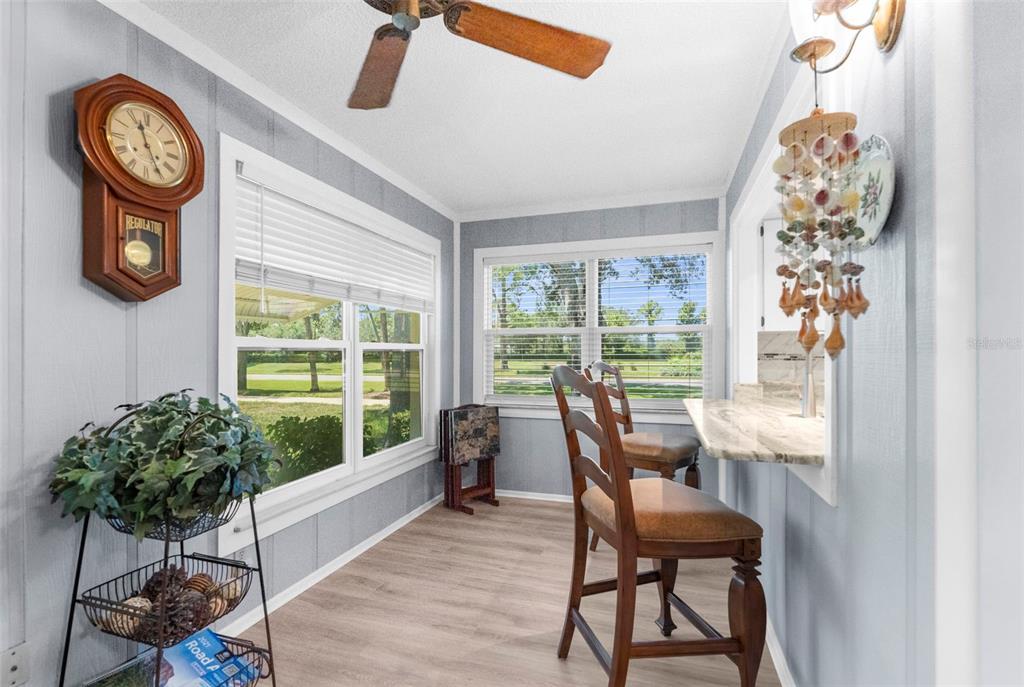 2509 Westchester Boulevard Spring Hill, FL 34606 - Photo 13 of 29 a dining room with furniture and a large window