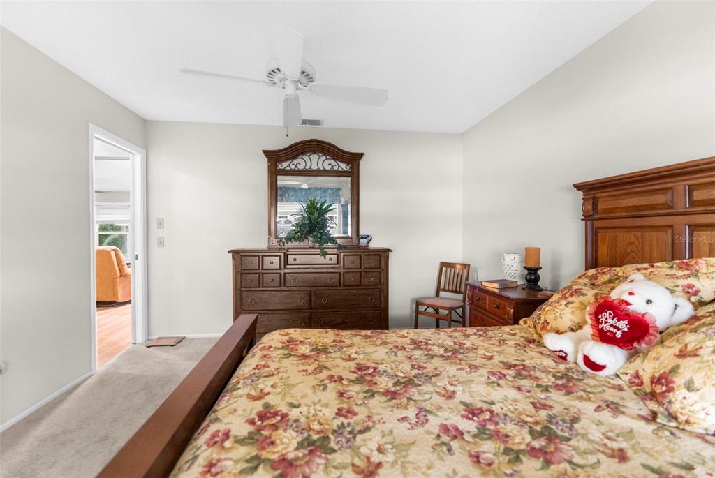 2509 Westchester Boulevard Spring Hill, FL 34606 - Photo 19 of 29 a bedroom with a bed and wooden floor