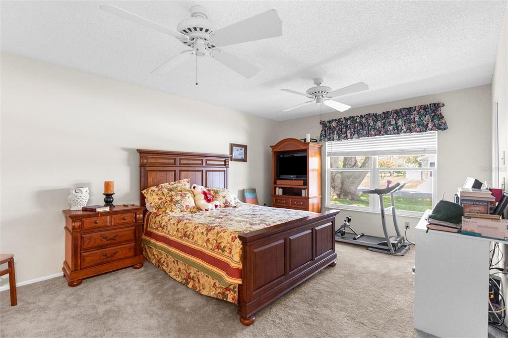 2509 Westchester Boulevard Spring Hill, FL 34606 - Photo 20 of 29 a bedroom with a bed and a chandelier