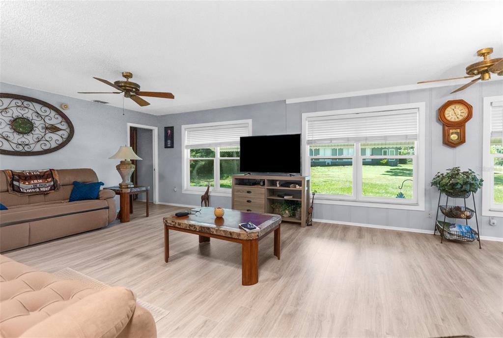 2509 Westchester Boulevard Spring Hill, FL 34606 - Photo 7 of 29 a living room with furniture a window and a flat screen tv