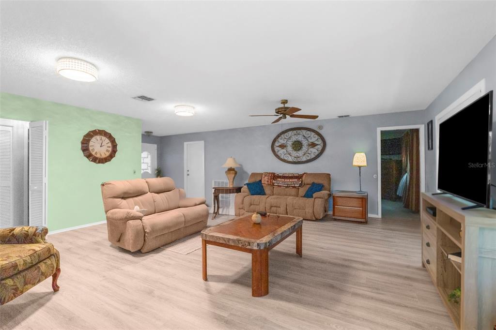 2509 Westchester Boulevard Spring Hill, FL 34606 - Photo 8 of 29 a living room with furniture and a flat screen tv