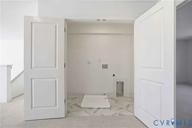 a sign broad in front of the red brick house