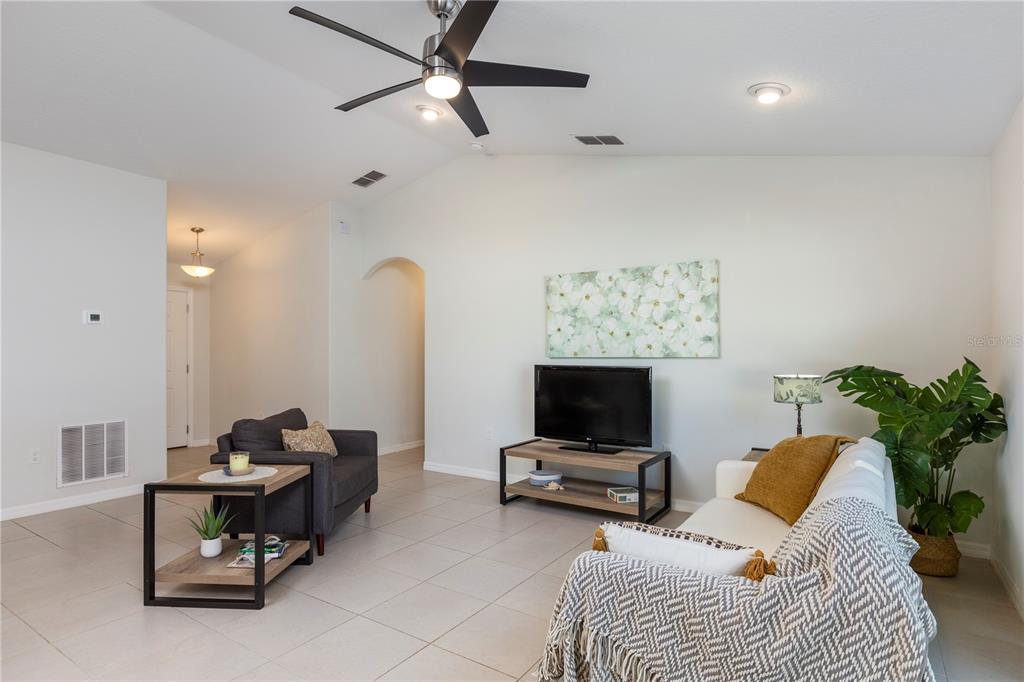 10 Rale Place Palm Coast, FL 32164 - Photo 11 of 27 a living room with furniture and a flat screen tv