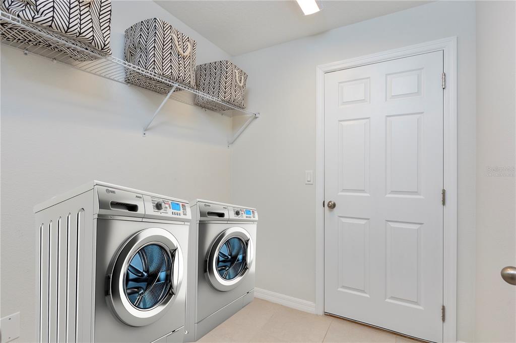 10 Rale Place Palm Coast, FL 32164 - Photo 12 of 27 a utility room with dryer and washer