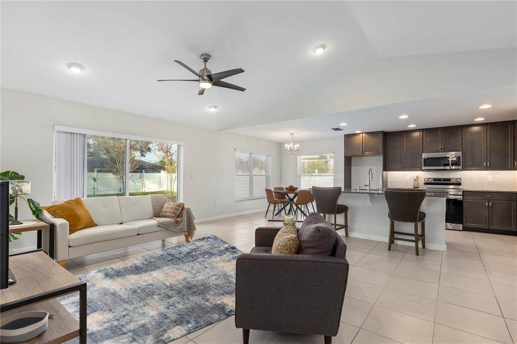 10 Rale Place Palm Coast, FL 32164 - Photo 3 of 27 a living room with furniture and kitchen view