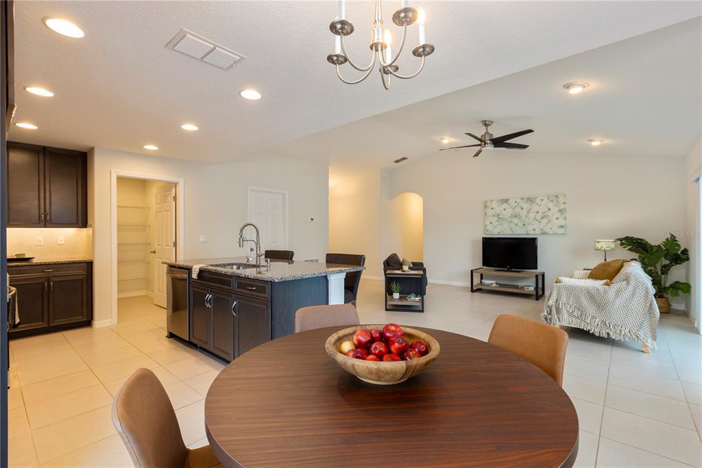 10 Rale Place Palm Coast, FL 32164 - Photo 10 of 27 a kitchen with a stove and chandelier