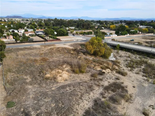 a aerial view of a house with a yard and covered with snow
