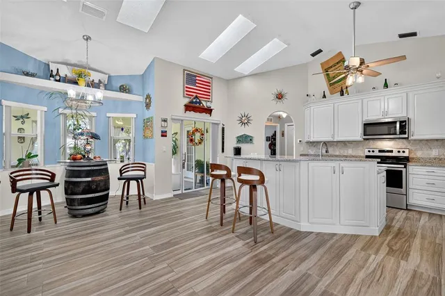 a view of kitchen with cabinets and wooden floor