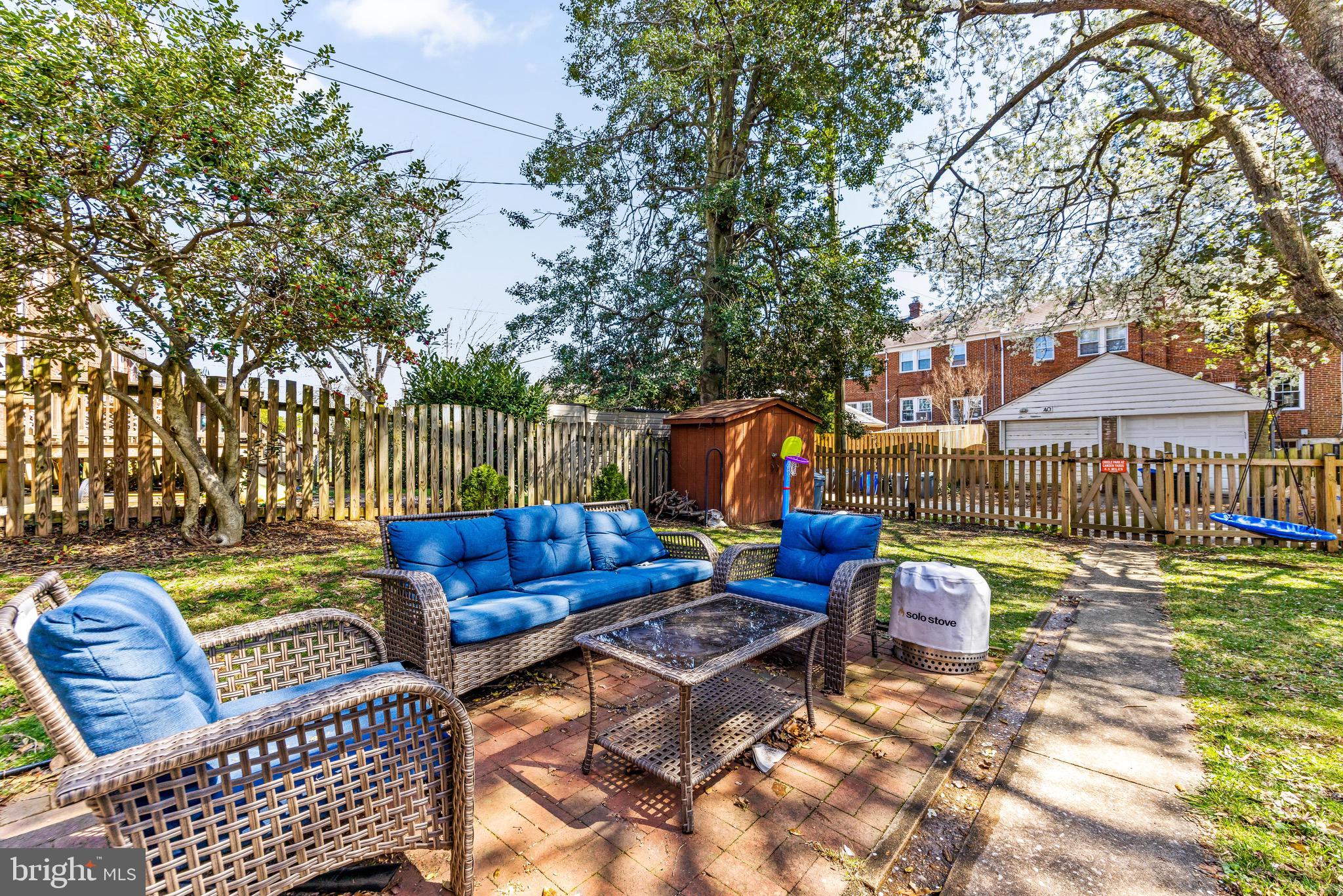 43 Murdock Road Baltimore, MD 21212 - Photo 36 of 42 a backyard of a house with barbeque oven table and chairs