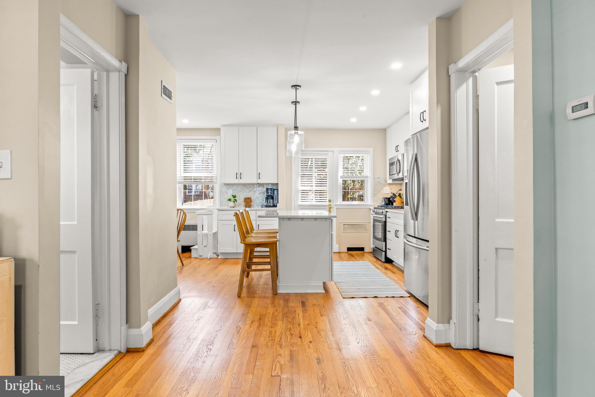 43 Murdock Road Baltimore, MD 21212 - Photo 7 of 42 a view of a kitchen with dining room and wooden floor