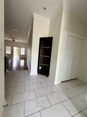 a living room with hard wood flooring