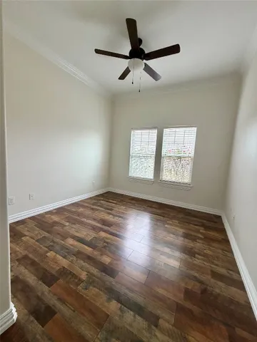 a bathroom with a bathtub sink vanity mirror and toilet