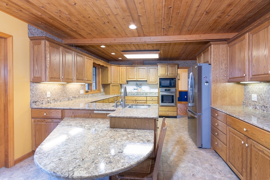 170 Bridge Street Warren, MA 01083 - Photo 11 of 34 a large kitchen with lots of counter space and wooden floor