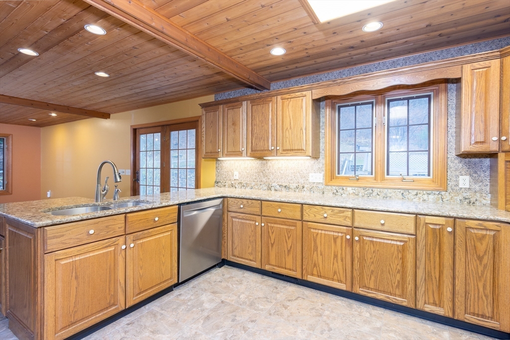 170 Bridge Street Warren, MA 01083 - Photo 12 of 34 a kitchen with granite countertop sink window and cabinets