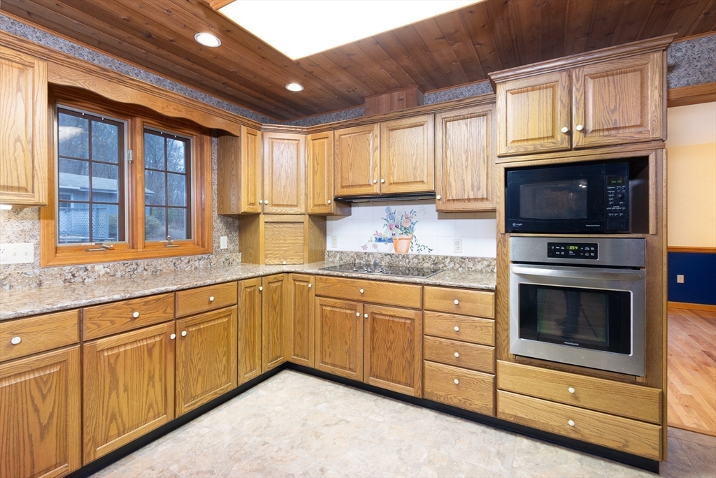 170 Bridge Street Warren, MA 01083 - Photo 13 of 34 a kitchen with granite countertop cabinets stainless steel appliances and a window
