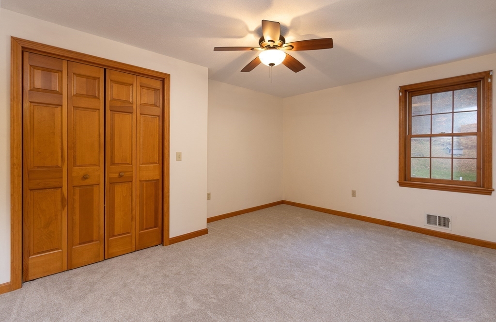 170 Bridge Street Warren, MA 01083 - Photo 22 of 34 an empty room with windows and chandelier fan