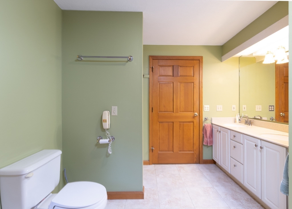 170 Bridge Street Warren, MA 01083 - Photo 26 of 34 a bathroom with a granite countertop toilet sink and mirror