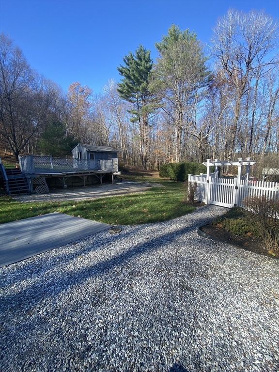 170 Bridge Street Warren, MA 01083 - Photo 8 of 34 a backyard of a house with lots of green space
