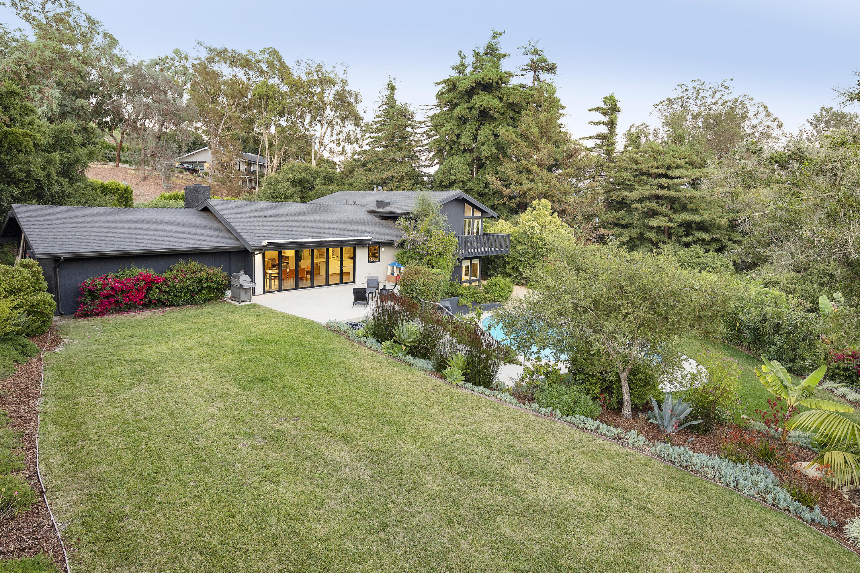 925 El Rancho Road Montecito, CA 93108 - Photo 2 of 28 a front view of a house with garden