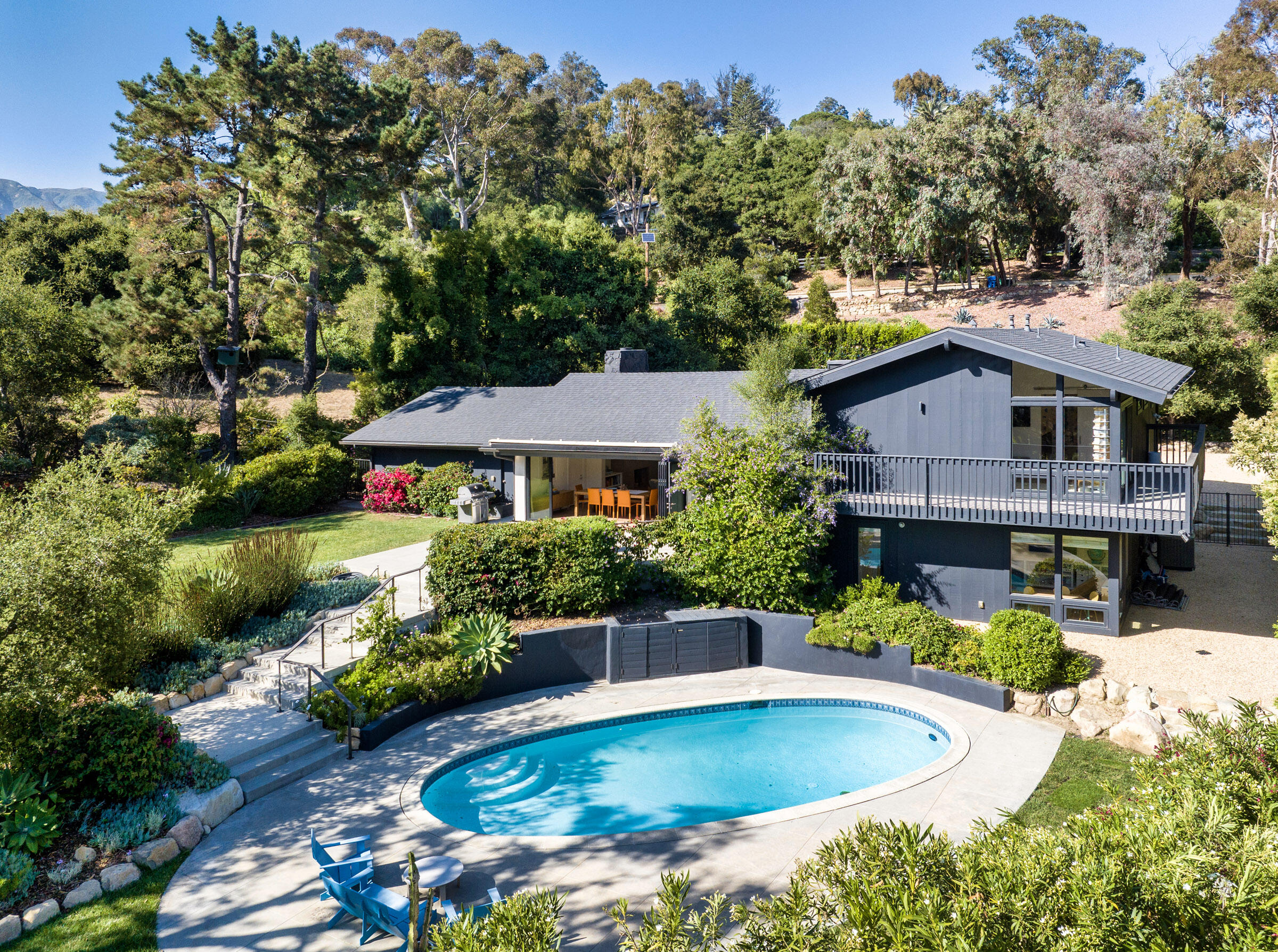 925 El Rancho Road Montecito, CA 93108 - Photo 26 of 28 a house with lots of trees in the background