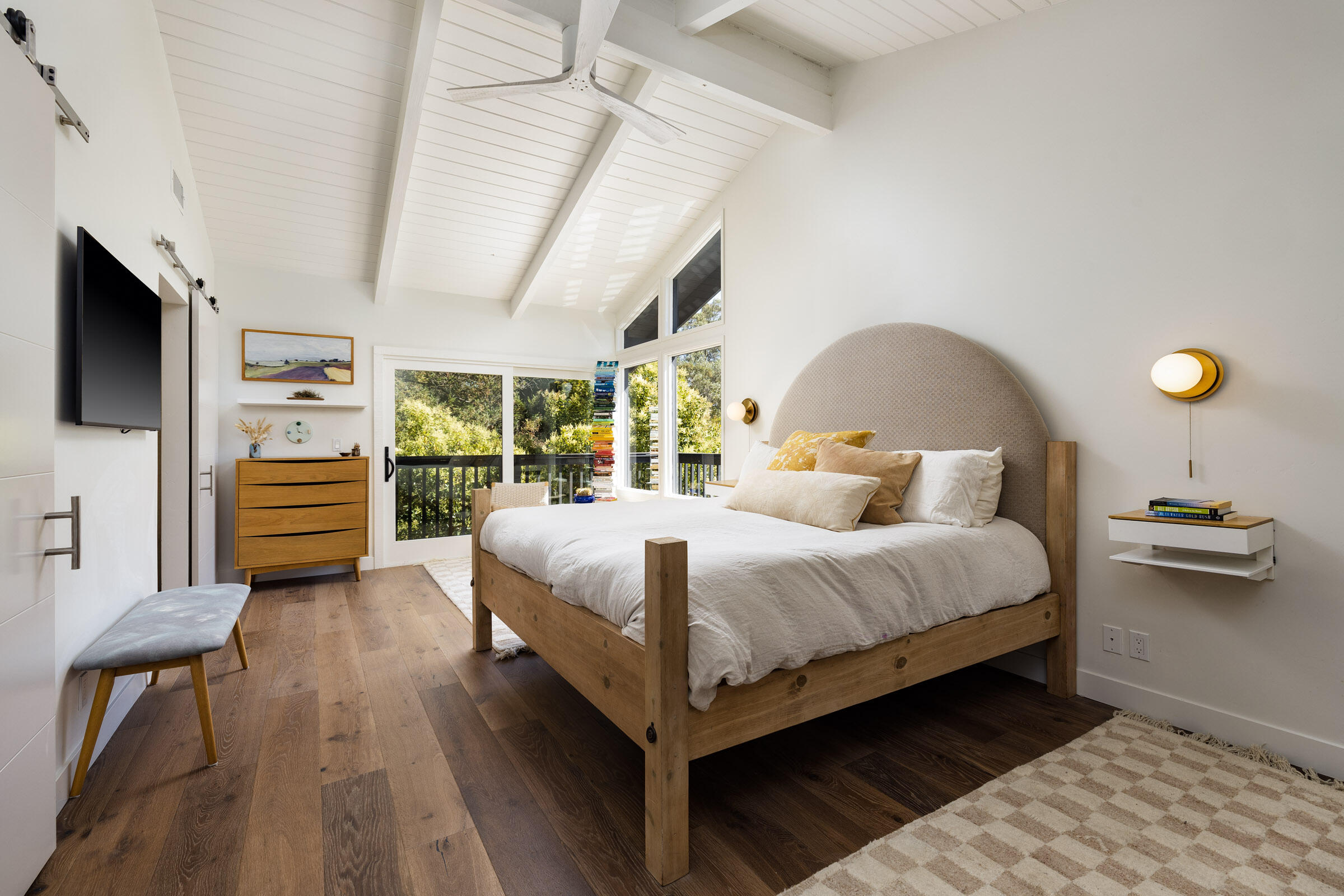 925 El Rancho Road Montecito, CA 93108 - Photo 9 of 28 a bedroom with a bed and wooden floor