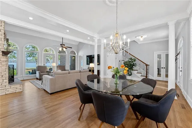 a view of an entryway with wooden floor and stairs