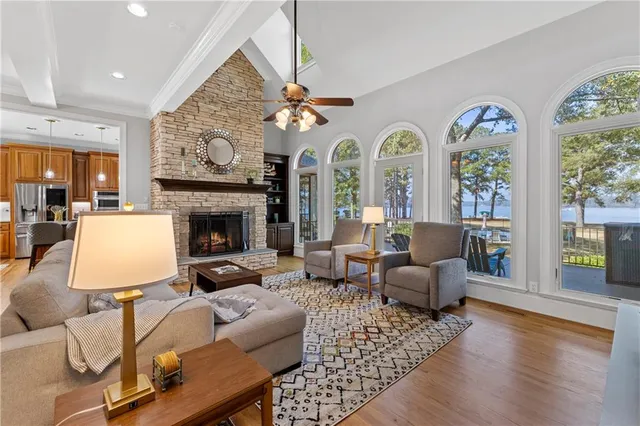 a bedroom with a bed window and a flat screen tv