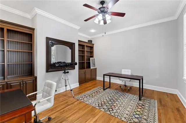 a bathroom with a granite countertop sink a mirror a bathtub and shower