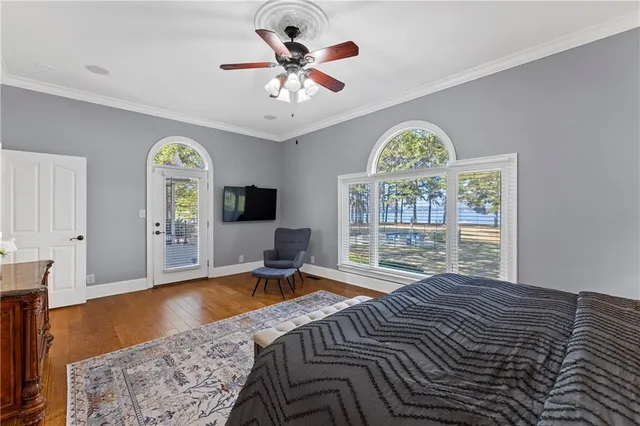 a large kitchen with granite countertop a stove a sink a dining table and chairs