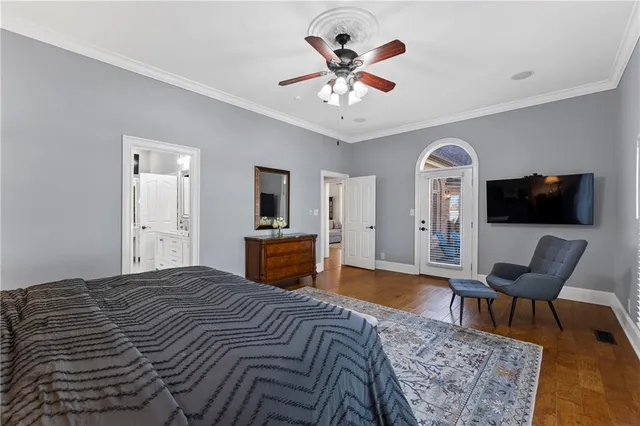 a kitchen with stainless steel appliances granite countertop a sink a stove and a wooden floors