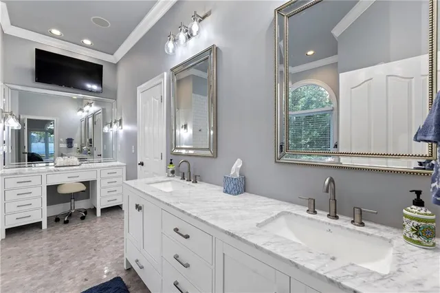 a kitchen with stainless steel appliances granite countertop a kitchen island a table and chairs