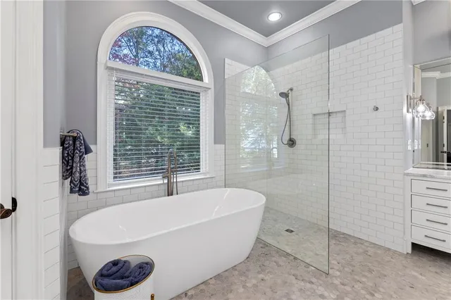 a dining room with furniture a fireplace and wooden floor