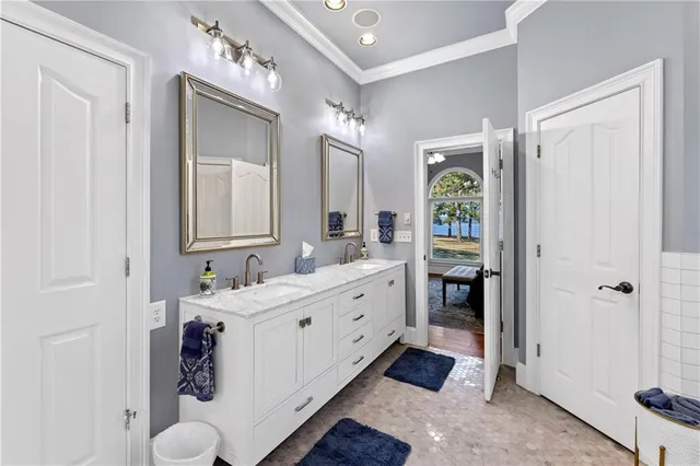a view of a hallway with wooden floor and entryway