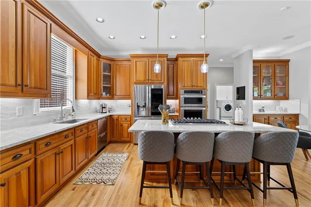 a bathroom with a toilet a sink and shower