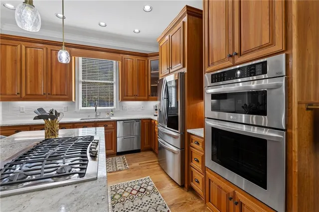 a view of a room with wooden floor and small hallway
