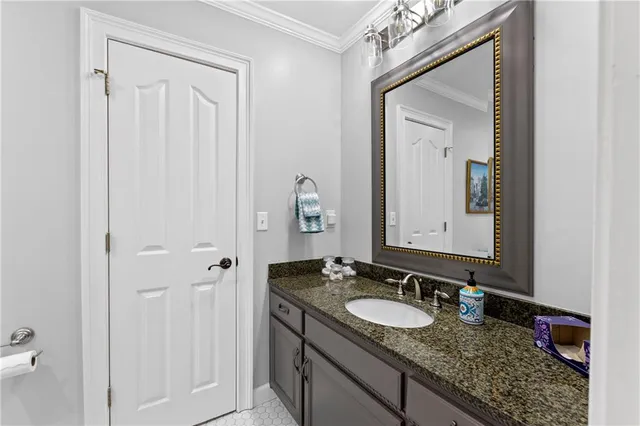 a view of an ocean with boats and trees in the background