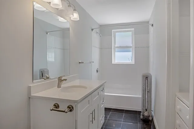 a bathroom with a sink and a bathtub