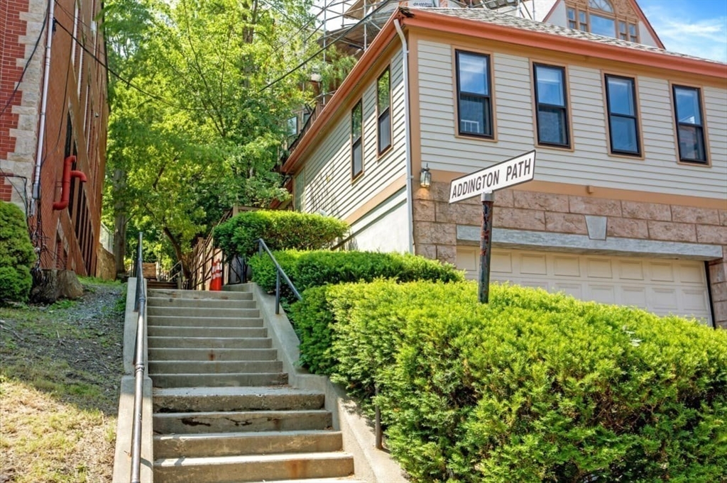 108 Winthrop Road, Unit 1 Brookline, MA 02445 - Photo 21 of 21 a front view of a house with a yard