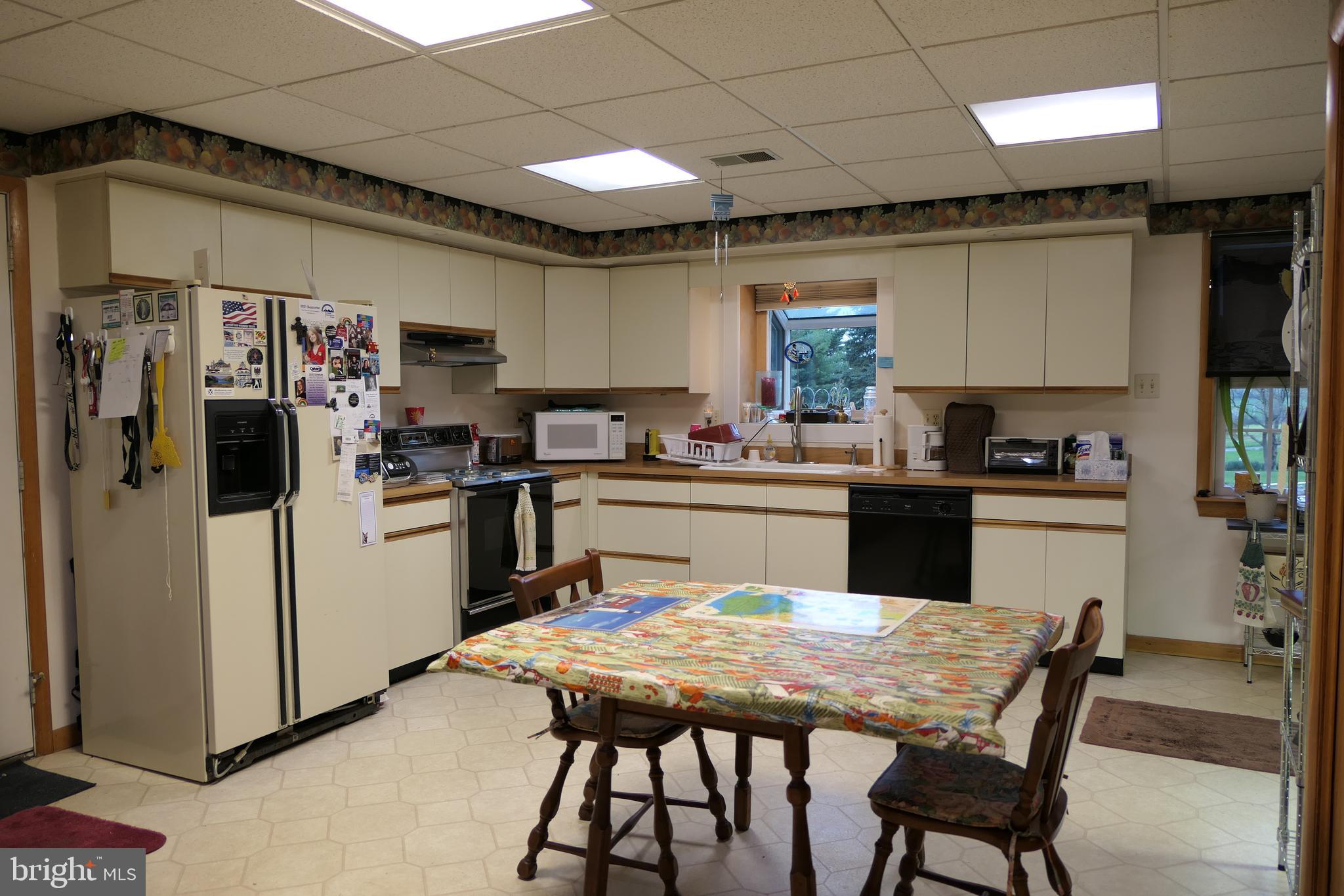15423 Dover Road Upperco, MD 21155 - Photo 33 of 50 Lower Lvl Eat-In Kitchen w/Vinyl & Laundry Closet
