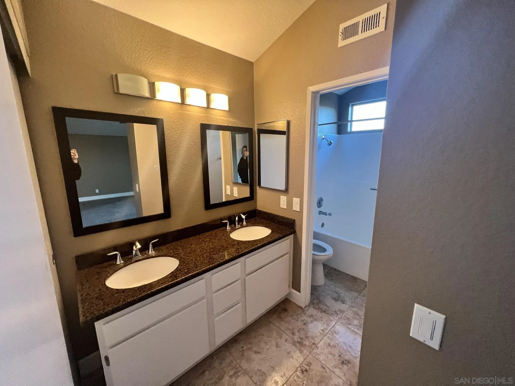 1565 Bay Meadows Drive Alpine, CA 91901 - Photo 13 of 23 a bathroom with a granite countertop double vanity sink and mirror