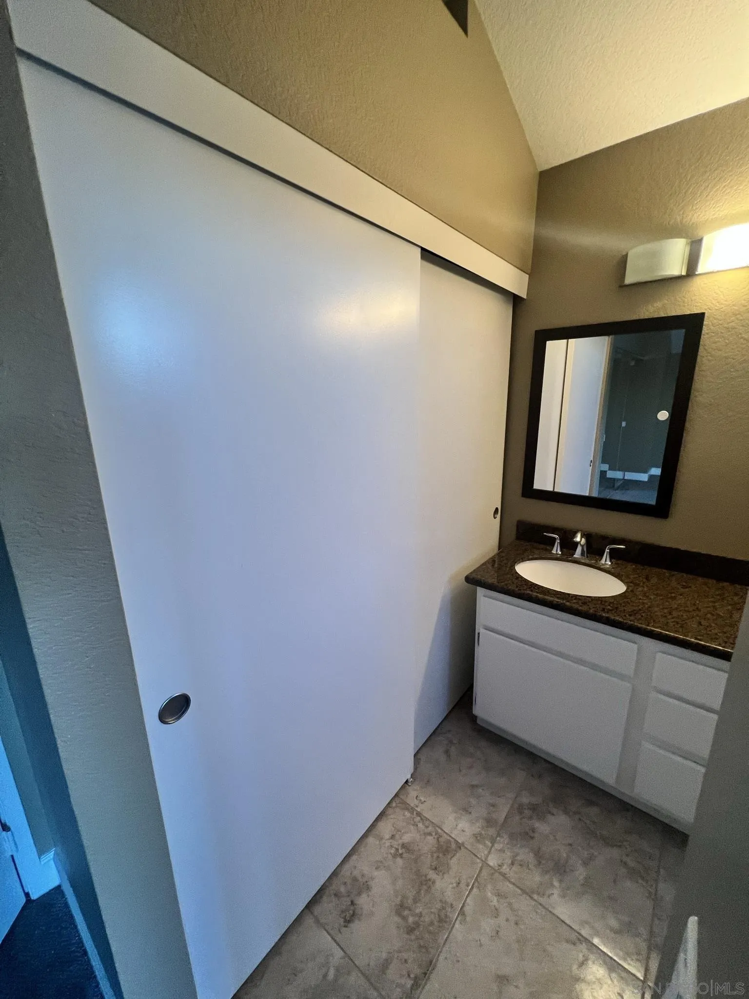 1565 Bay Meadows Drive Alpine, CA 91901 - Photo 14 of 23 a bathroom with a sink and a mirror