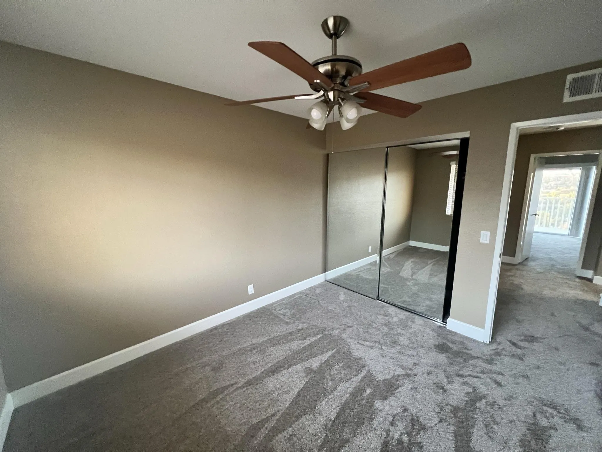1565 Bay Meadows Drive Alpine, CA 91901 - Photo 19 of 23 a view of a big room with wooden floor and chandelier fan